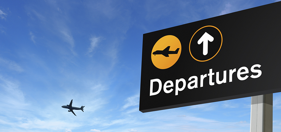aeroplane and departure sign