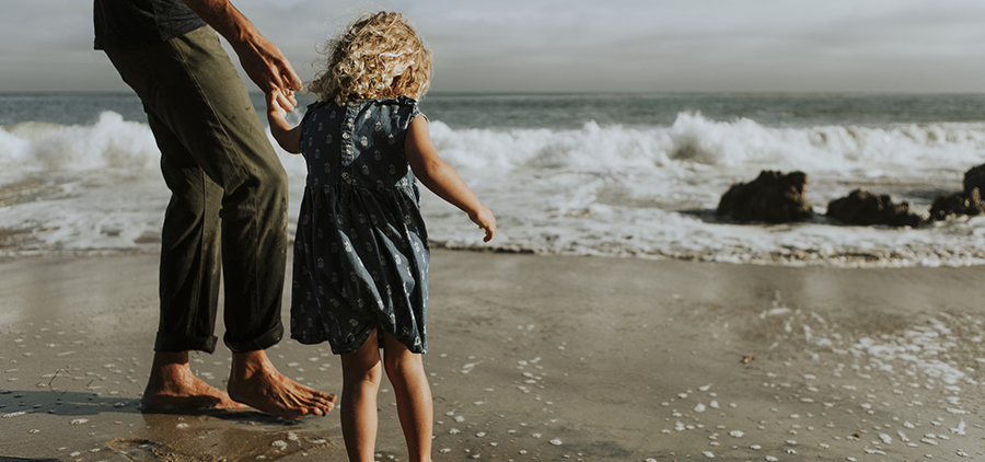 Father and daughter at a beach