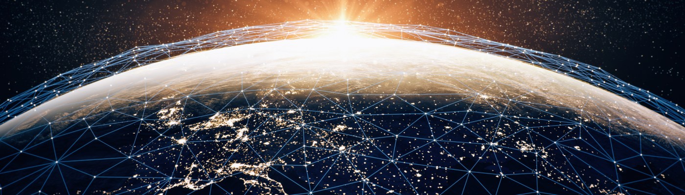 Globe with connections, city lights and the sun.