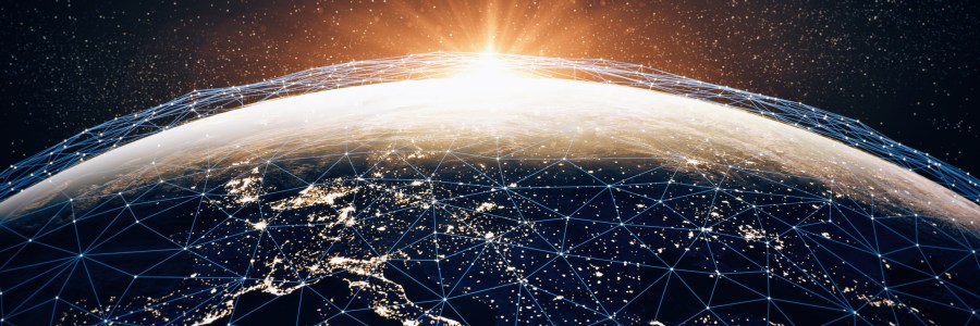 Globe with connections, city lights and the sun.